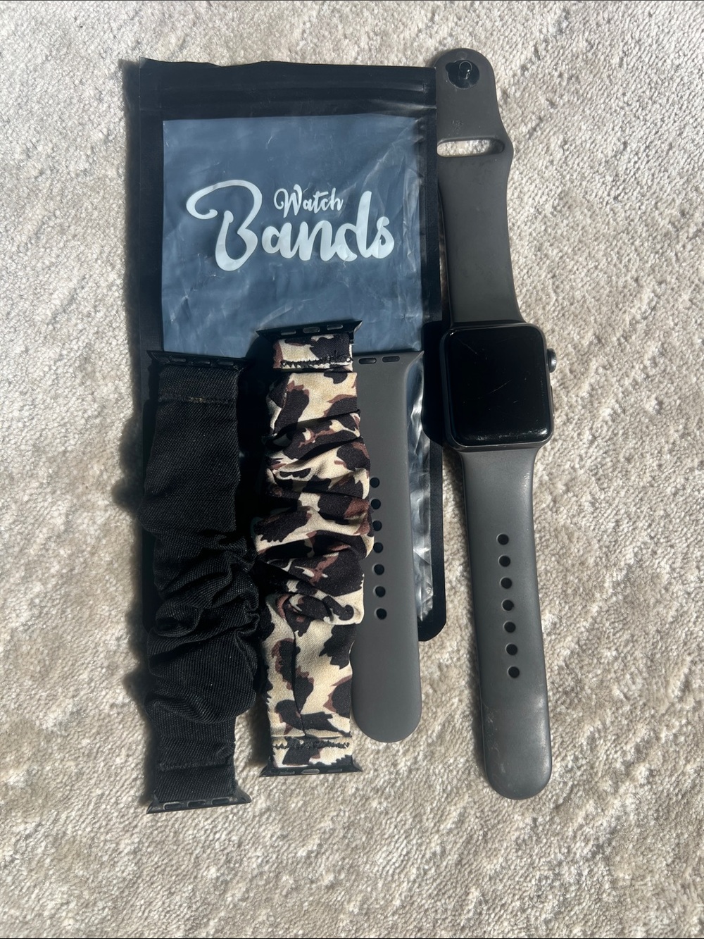 Apple Black Smartwatch with Black Silicone Bands and magnetic charger
